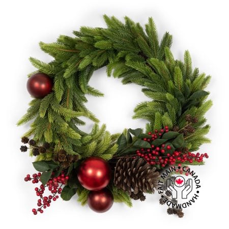 Berry and red ornament decorated Christmas wreath