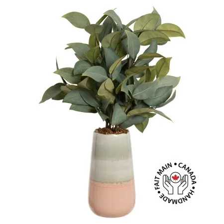 Bouquet of artificial eucalyptus in a pink vase