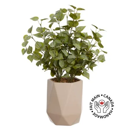 Artificial eucalyptus foliage in a beige vase
