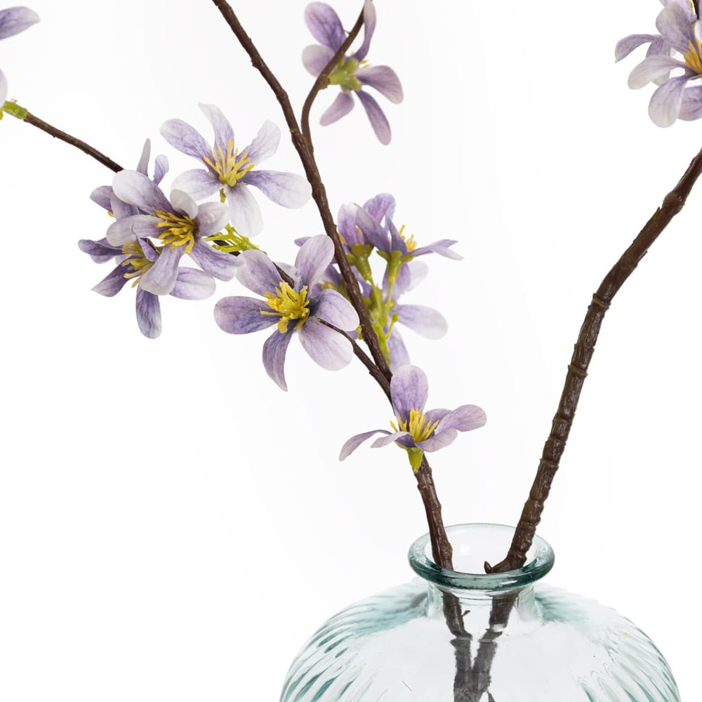 Branche de fleurs mauves artificielles en vase de verre - Décors Véronneau