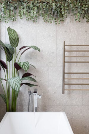 Artificial Ctenanthe and trailing foliage in a bathroom