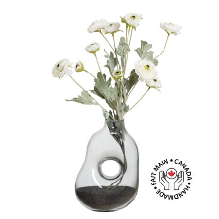 Bouquet of white wildflowers in a geometric vase