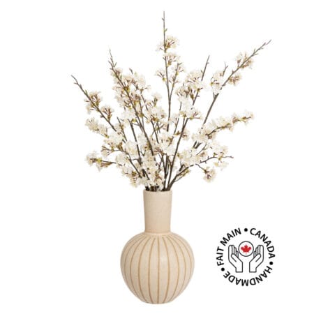 Oversized bouquet of cherry blossom branches in a vase