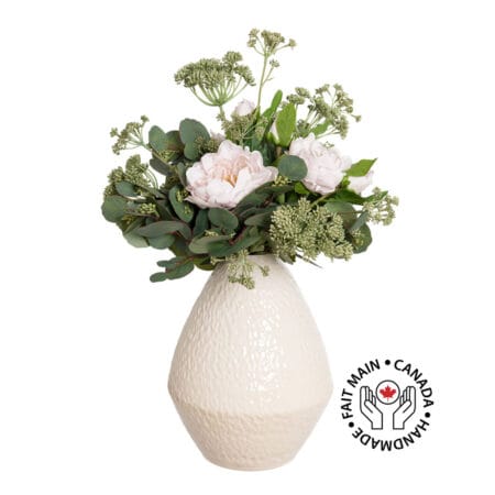 Bouquet of pale pink peonies and eucalyptus foliage